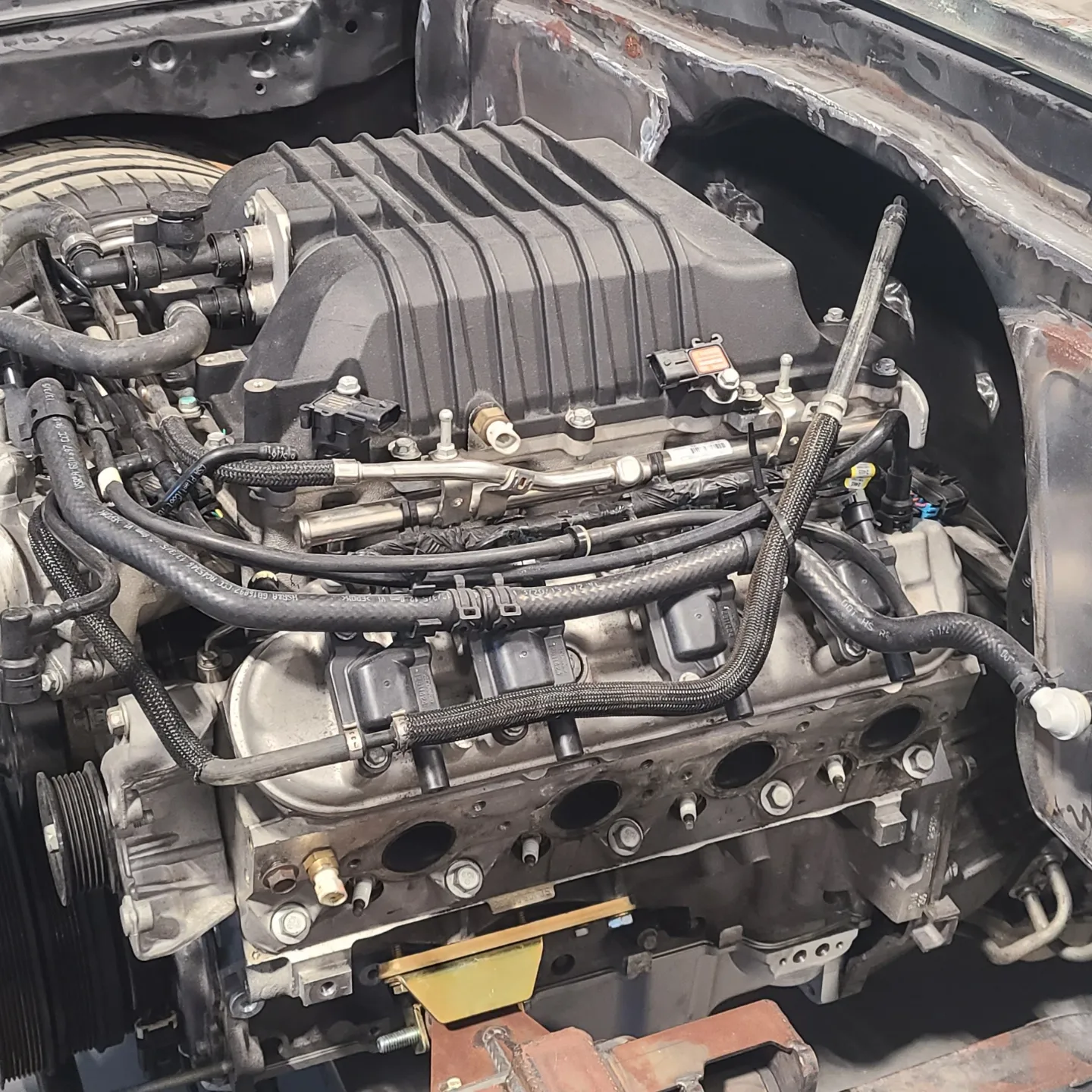 A car engine with many different parts in it